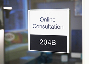 "online consultation" sign on glass door